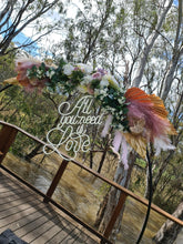 Load image into Gallery viewer, All You Need Is LOVE Neon Sign for Hire - only available when hiring a backdrop and ordering a balloon garland by UpUpNAwayBalloons