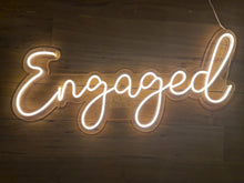 Load image into Gallery viewer, Engaged Neon Sign for Hire - only available when hiring a backdrop and ordering a balloon garland by UpUpNAwayBalloons