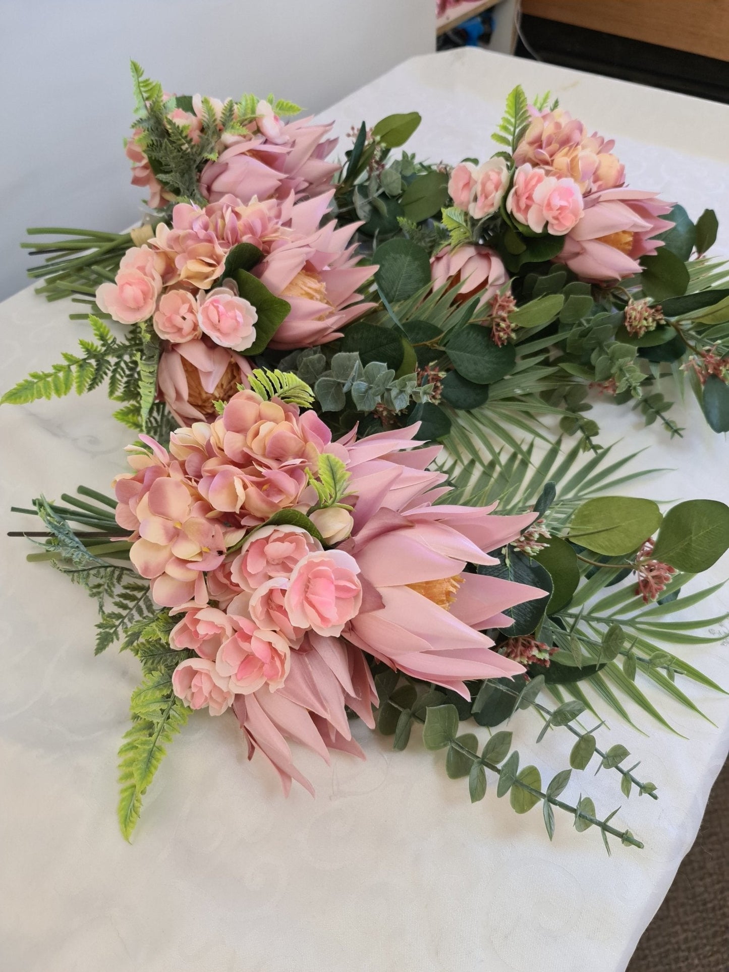 Artificial Flowers and Greenery for hire - available for hire when hiring a backdrop with us and an Organic Balloon Garland by UpUpNAwayBalloons