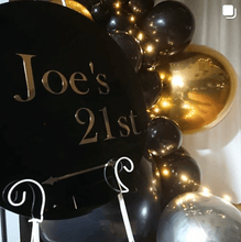 Load image into Gallery viewer, Black Acrylic Disk Sign Hire (not available to hire without a backdrop and organic garlands) by UpUpNAwayBalloons
