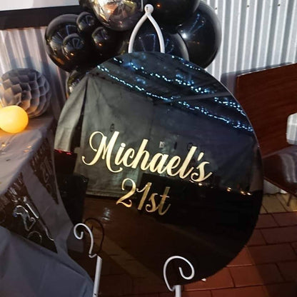 Black Acrylic Disk Sign Hire (not available to hire without a backdrop and organic garlands) by UpUpNAwayBalloons