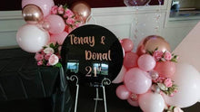 Load image into Gallery viewer, Black Acrylic Disk Sign Hire (not available to hire without a backdrop and organic garlands) by UpUpNAwayBalloons
