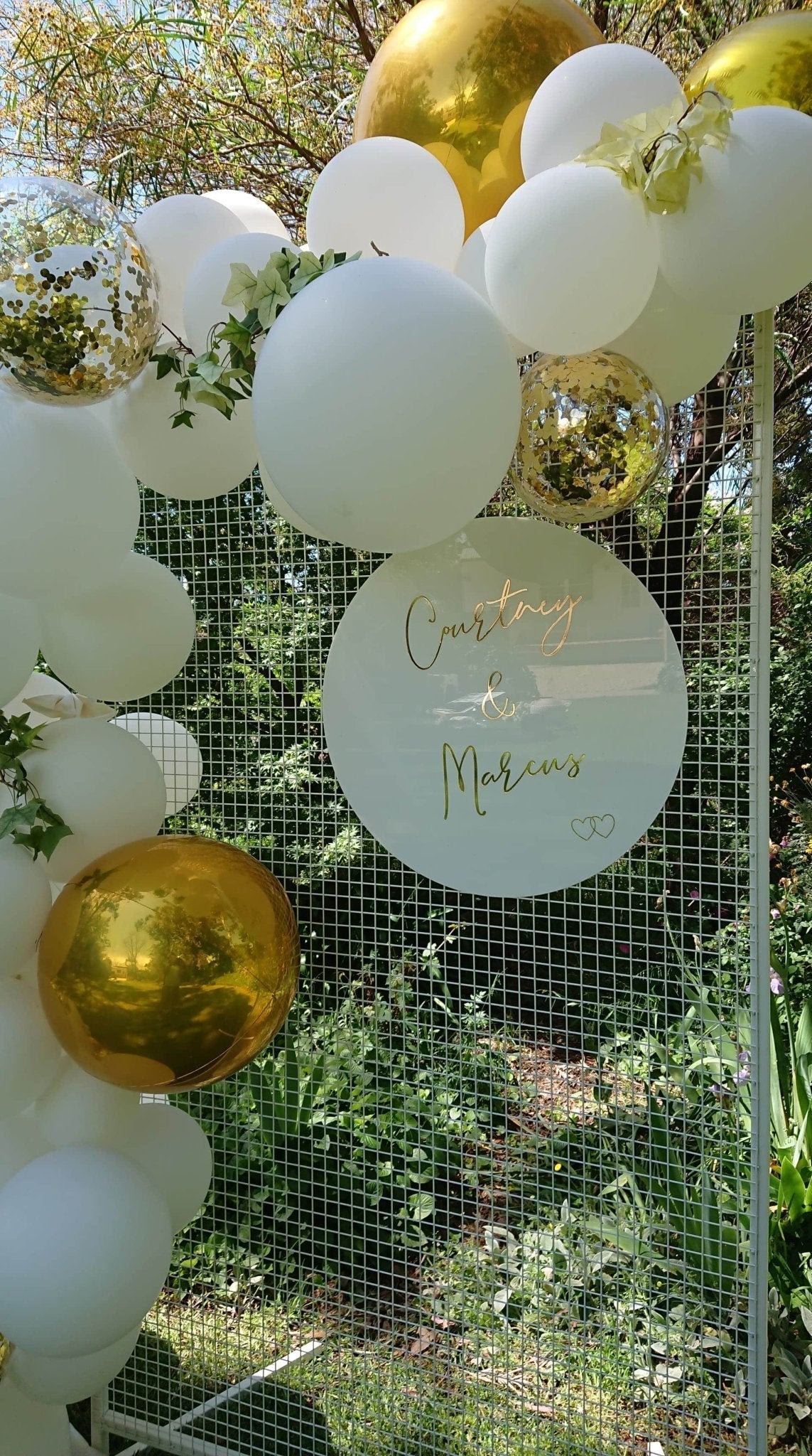 White Acrylic Disk Sign Hire (not available to hire without a backdrop and organic garlands) by UpUpNAwayBalloons