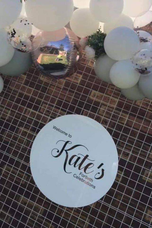 White Acrylic Disk Sign Hire (not available to hire without a backdrop and organic garlands) by UpUpNAwayBalloons