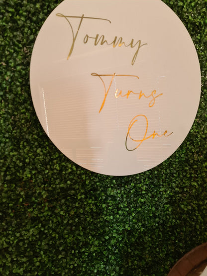 White Acrylic Disk Sign Hire (not available to hire without a backdrop and organic garlands) by UpUpNAwayBalloons