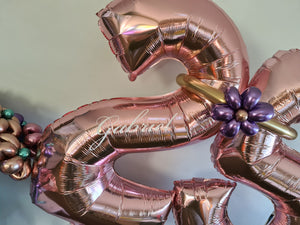 personalised balloon numbers [double digit with tassels or bubble balloons at the neck.